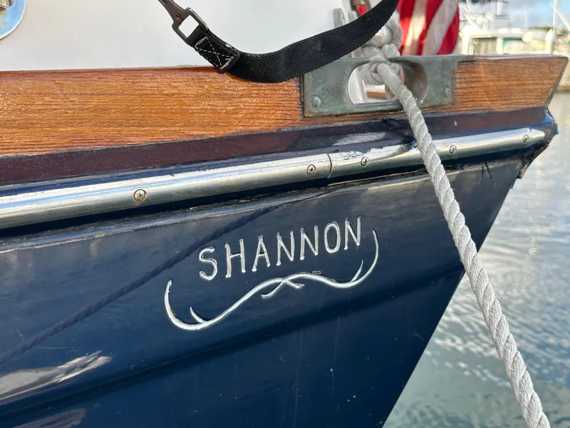 Slide: The Image of Shannon 43 Classic Cutter, 1985, docked with rope and wooden trim detail. - 21