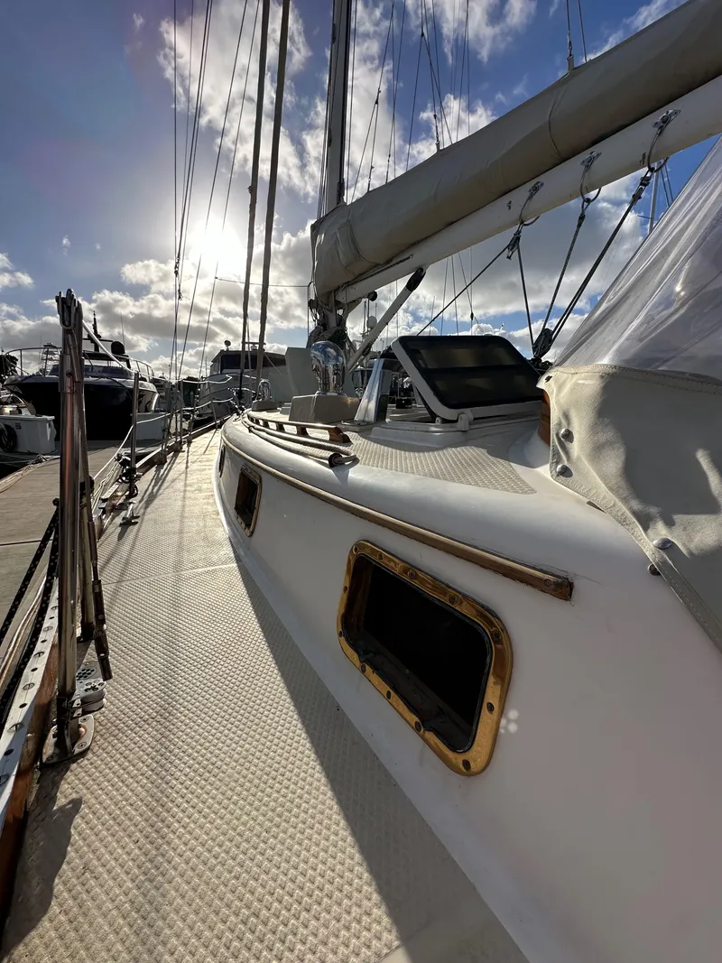 Slide: The Image of 1985 Shannon 43 Classic Cutter sailboat docked, sunlit deck, and rigging details. - 23