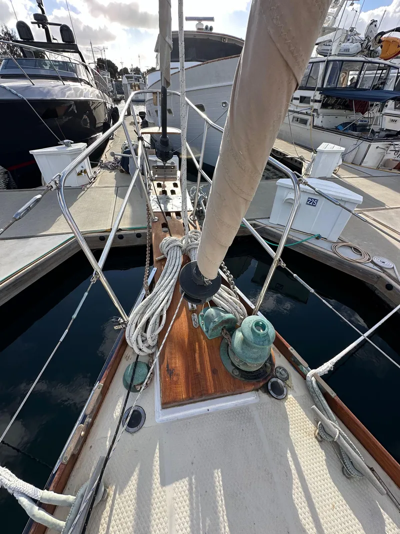 Slide: The Image of 1985 Shannon 43 Classic Cutter sailboat docked, showcasing deck and rigging details. - 29