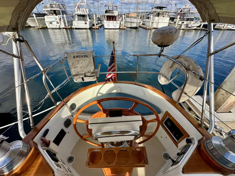 Slide: The Image of Cockpit view of 1985 Shannon 43 Classic Cutter sailboat in marina. - 39