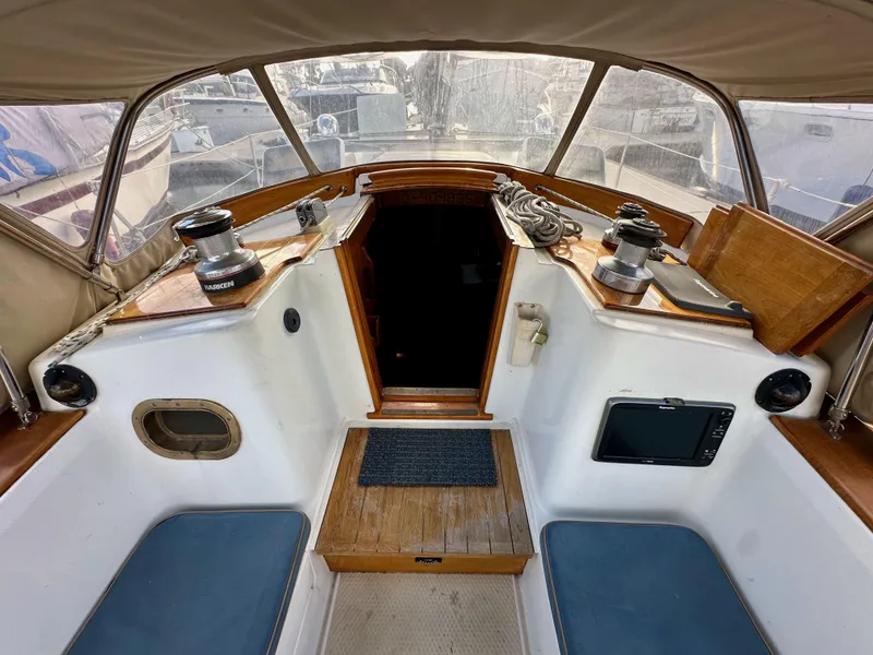 Slide: The Image of Cockpit of 1985 Shannon 43 Classic Cutter with seating and winches. - 46