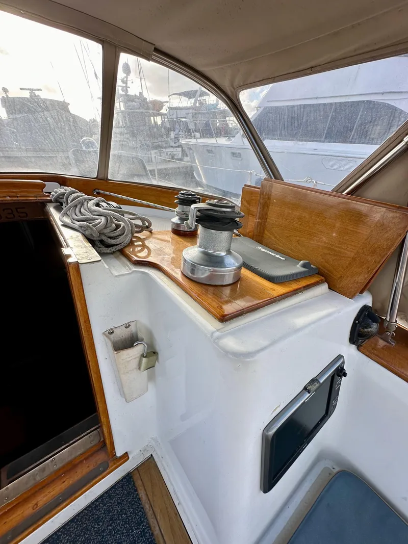 Slide: The Image of 1985 Shannon 43 Classic Cutter sailboat cockpit with winches and ropes. - 48