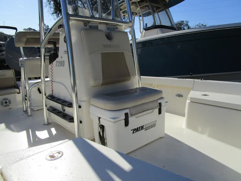 Slide: The Image of 2016 Pathfinder 2200 TRS boat interior with seating and storage. - 5