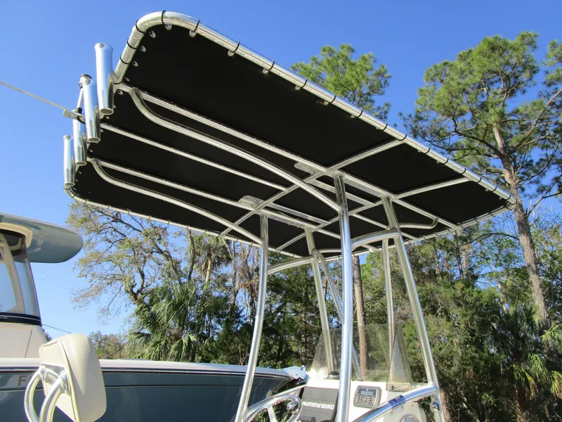 Slide: The Image of 2016 Pathfinder 2200 TRS boat with T-top canopy against a clear blue sky. - 9