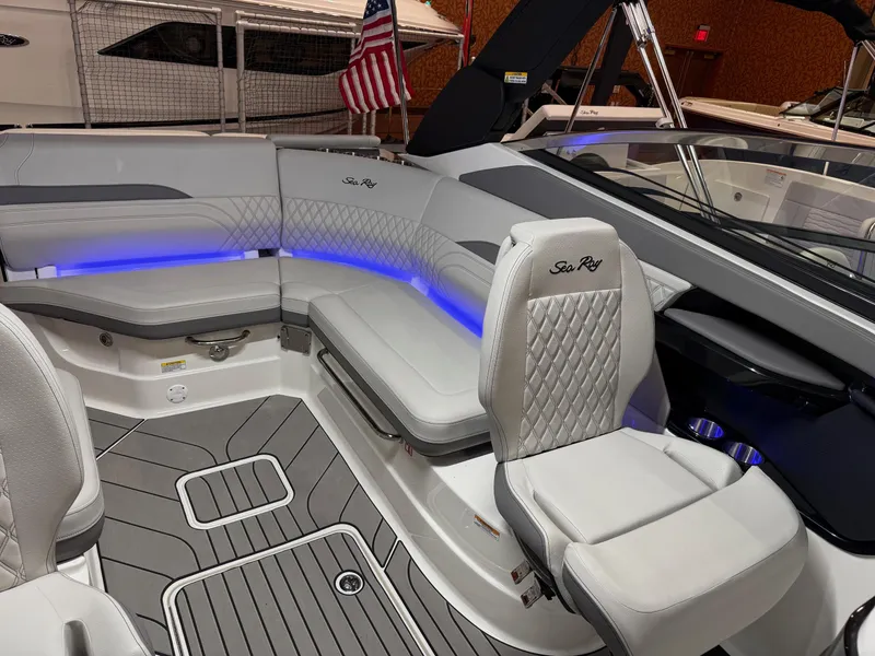 Slide: The Image of 2024 Sea Ray SLX 260 boat interior with luxurious seating and ambient lighting. - 10