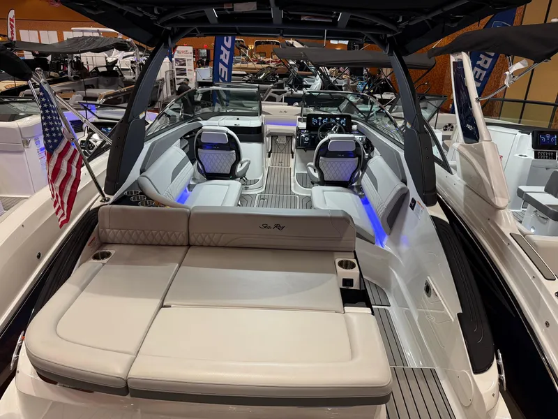 Slide: The Image of 2024 Sea Ray SLX 260 luxury boat interior with seating and American flag. - 3