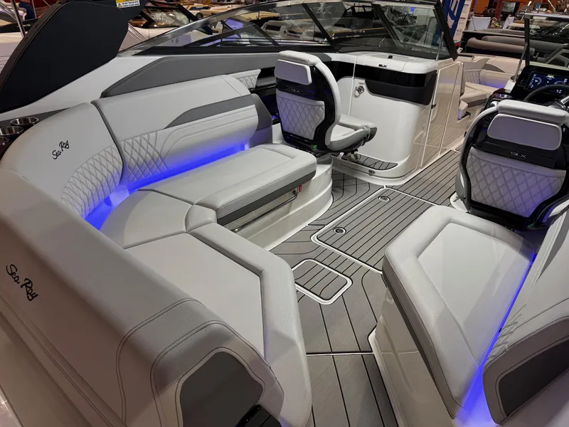 Slide: The Image of Luxurious 2024 Sea Ray SLX 260 boat interior with elegant seating and ambient lighting. - 4