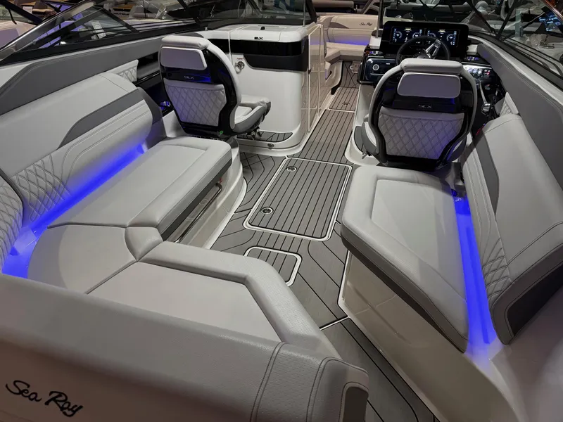 Slide: The Image of 2024 Sea Ray SLX 260 boat interior with luxurious seating and ambient lighting. - 5