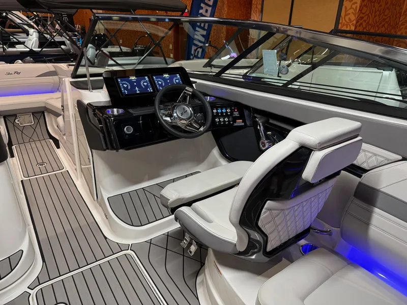 Slide: The Image of 2024 Sea Ray SLX 260 boat interior with modern dashboard and luxurious seating. - 6
