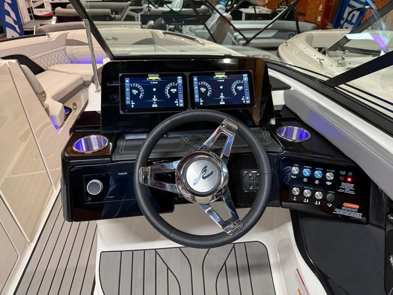 Slide: The Image of 2024 Sea Ray SLX 260 dashboard with modern controls and dual display screens. - 7