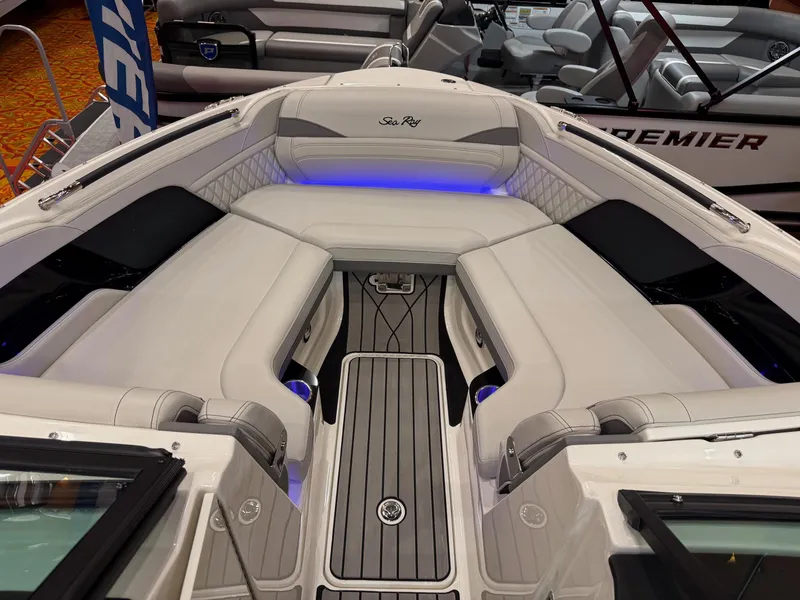 Slide: The Image of 2024 Sea Ray SLX 260 boat interior with luxurious seating and ambient lighting. - 8