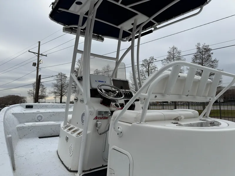 Slide: The Image of 2012 Blazer 2400 boat interior with steering console and seating. - 23