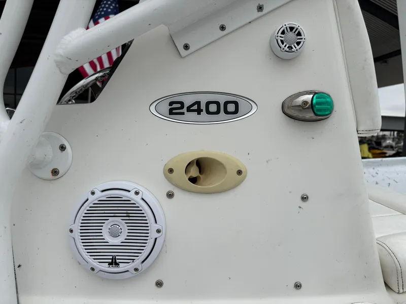 Slide: The Image of Close-up of a 2012 Blazer 2400 boat dashboard with speakers and controls. - 24