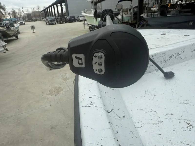 Slide: The Image of Close-up of a boat motor on a 2012 Blazer 2400 in a marina. - 3