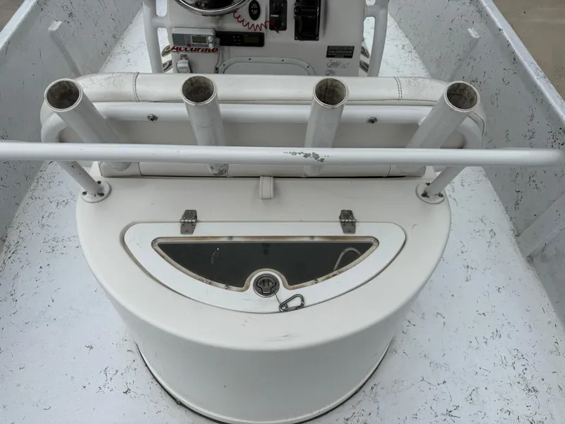 Slide: The Image of Interior of a 2012 Blazer 2400 boat with rod holders and storage compartment. - 7