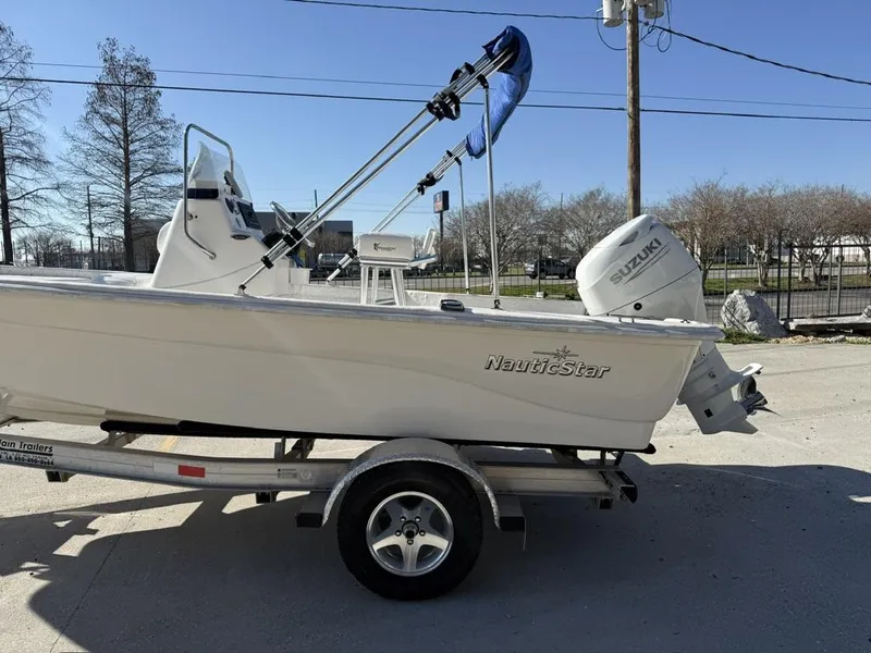 Slide: The Image of 2011 NauticStar 190R RG boat on trailer with Suzuki outboard motor. - 14