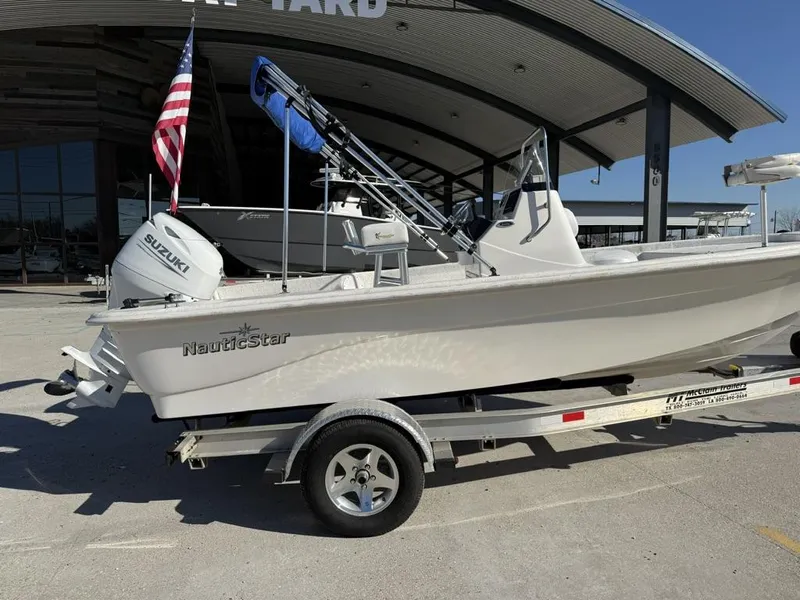 Slide: The Image of 2011 NauticStar 190R RG boat on trailer with Suzuki outboard motor. - 6