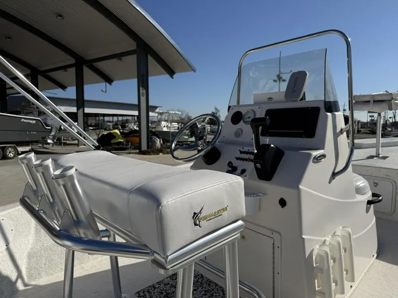 Slide: The Image of 2011 NauticStar 190R RG boat interior with steering console and seating. - 8