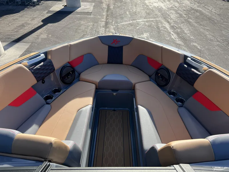 Slide: The Image of 2025 MasterCraft XT25 boat interior with spacious seating and modern design. - 10