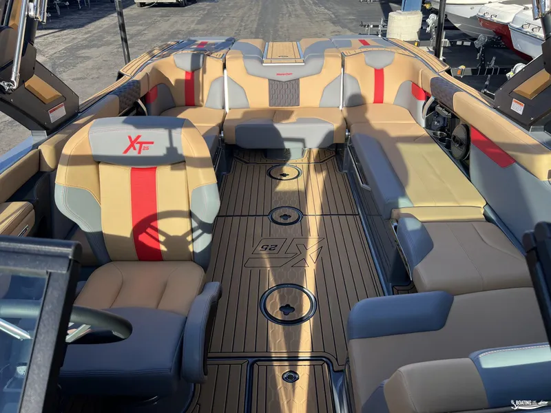Slide: The Image of 2025 MasterCraft XT25 boat interior with stylish seating and modern design. - 11