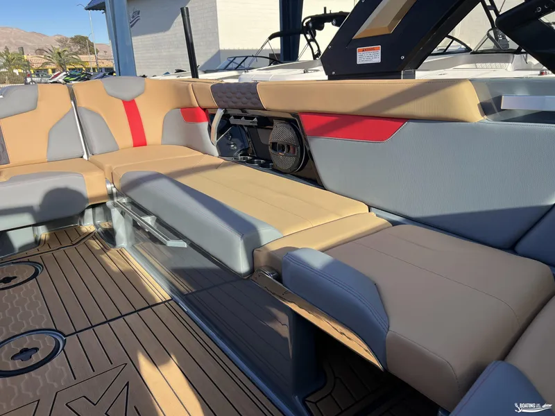 Slide: The Image of 2025 MasterCraft XT25 boat interior with stylish seating and modern design. - 14