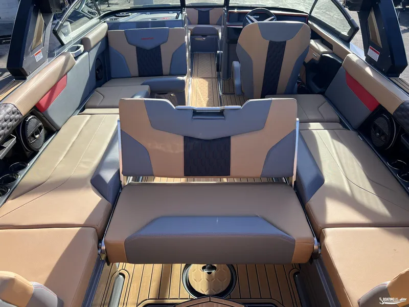 Slide: The Image of 2025 MasterCraft XT25 boat interior with luxurious seating and modern design. - 17