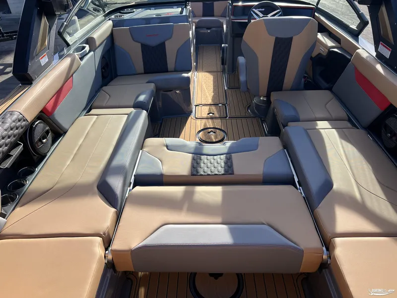 Slide: The Image of 2025 MasterCraft XT25 boat interior with luxurious seating and modern design. - 18