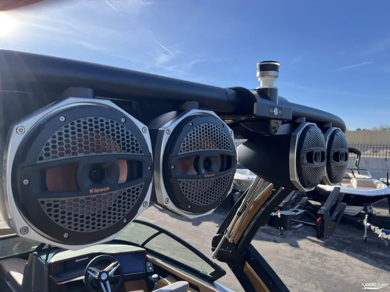 Slide: The Image of MasterCraft XT25 2025 boat with Klipsch speakers on a sunny day. - 22