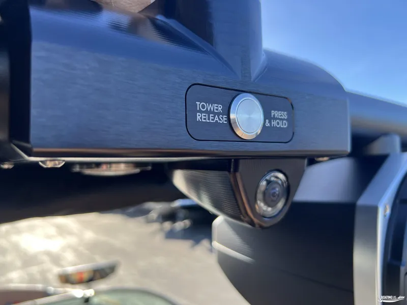 Slide: The Image of Close-up of 2025 MasterCraft XT25 tower release button and camera. - 23