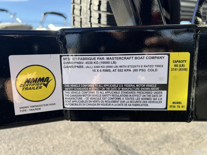Slide: The Image of Label on MasterCraft XT25 trailer, 2025 model, showing weight and safety specifications. - 29