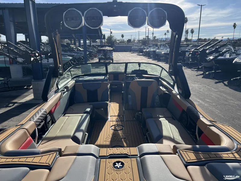 Slide: The Image of 2025 MasterCraft XT25 boat interior with spacious seating and modern design. - 5