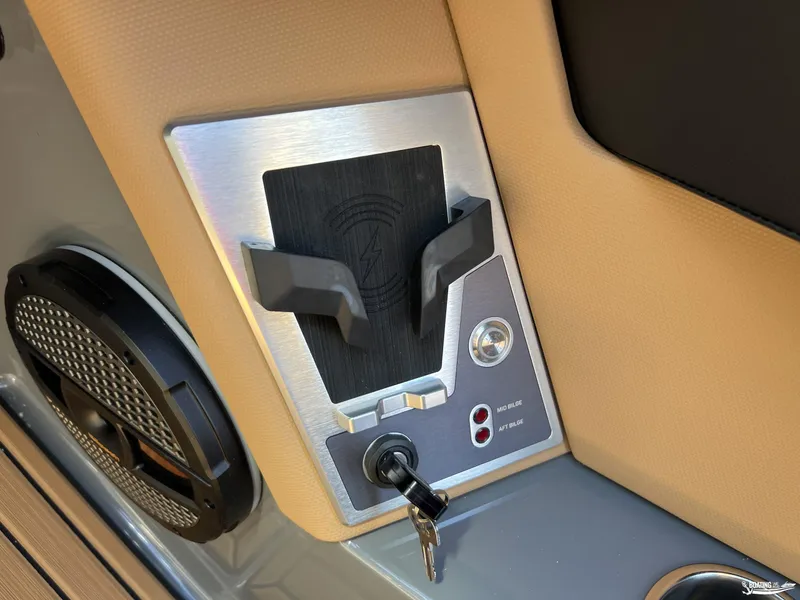 Slide: The Image of Control panel of 2025 MasterCraft XT25 boat with key and speaker. - 9