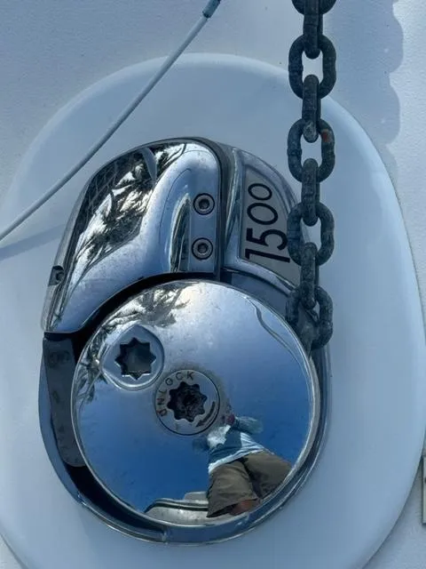 Slide: The Image of Close-up of a 1998 Viking 43 Convertible boat's anchor windlass with chain. - 15