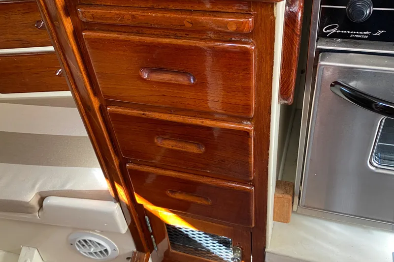 Slide: The Image of Wooden cabinetry in a 1962 Cheoy Lee Custom boat interior. - 26
