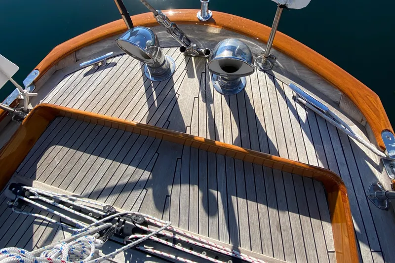 Slide: The Image of 1962 Cheoy Lee Custom yacht deck with wooden finish and nautical equipment. - 38