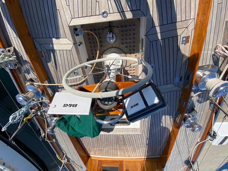 Slide: The Image of 1962 Cheoy Lee Custom yacht deck with steering wheel and navigation equipment. - 40