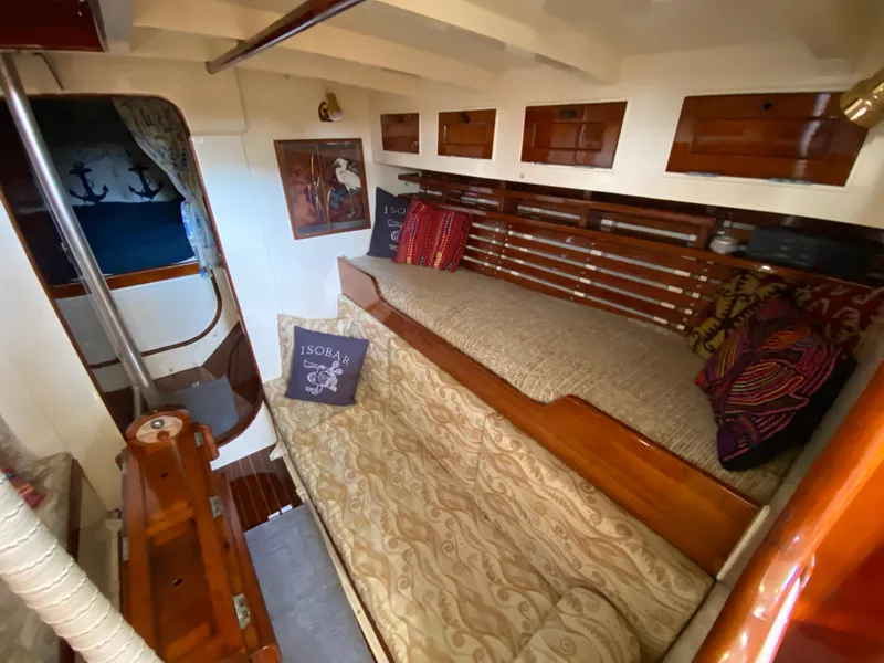 Slide: The Image of Interior of 1962 Cheoy Lee Custom yacht with cozy seating and nautical decor. - 8