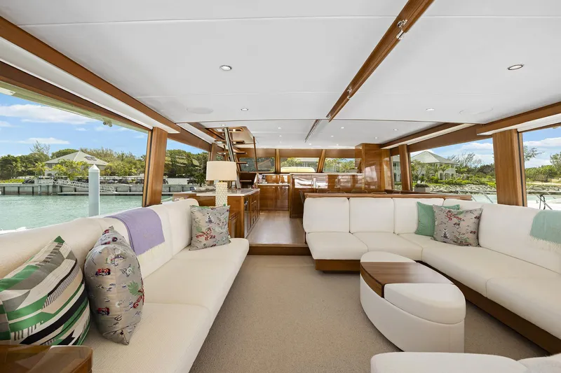 Slide: The Image of Luxurious interior of 2026 Grand Banks GB 85 yacht with elegant seating and scenic views. - 16