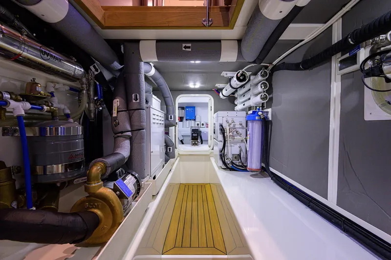 Slide: The Image of Engine room of 2026 Grand Banks GB 85 yacht, showcasing advanced mechanical systems. - 23