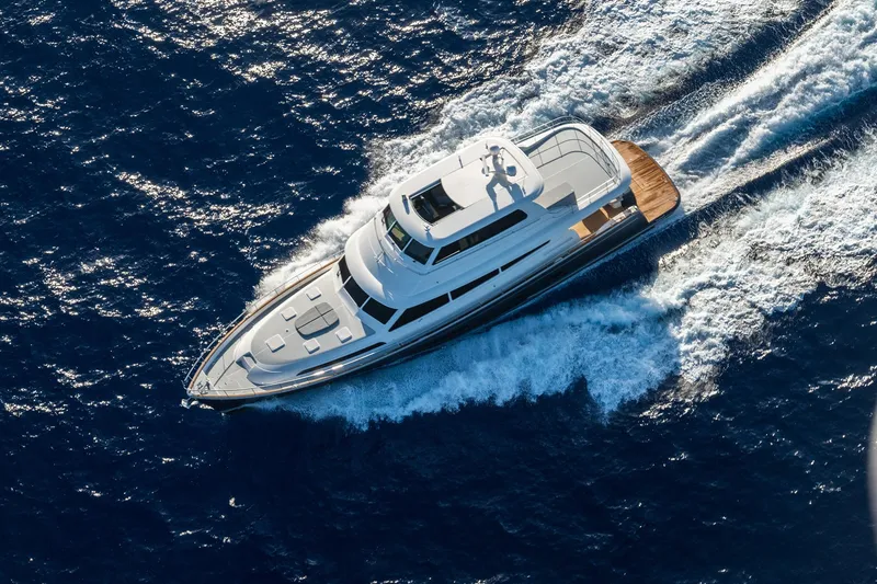 Slide: The Image of Grand Banks GB 85 yacht cruising on open sea, 2026 model. - 25