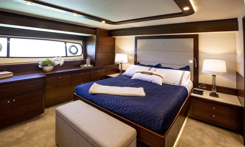 Slide: The Image of Luxurious bedroom interior of 2026 Grand Banks GB 85 yacht with elegant furnishings. - 8
