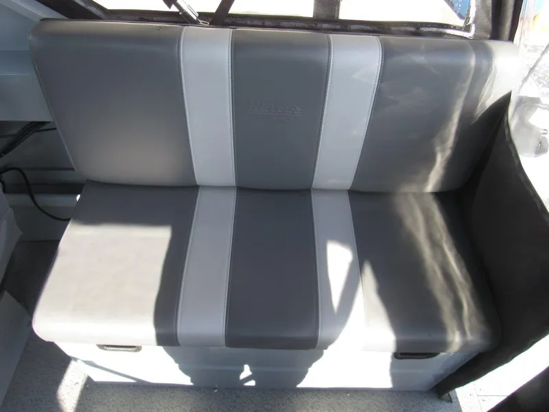 Slide: The Image of 2023 Hewescraft 210 Sea Runner ET, gray and white boat seat interior. - 15