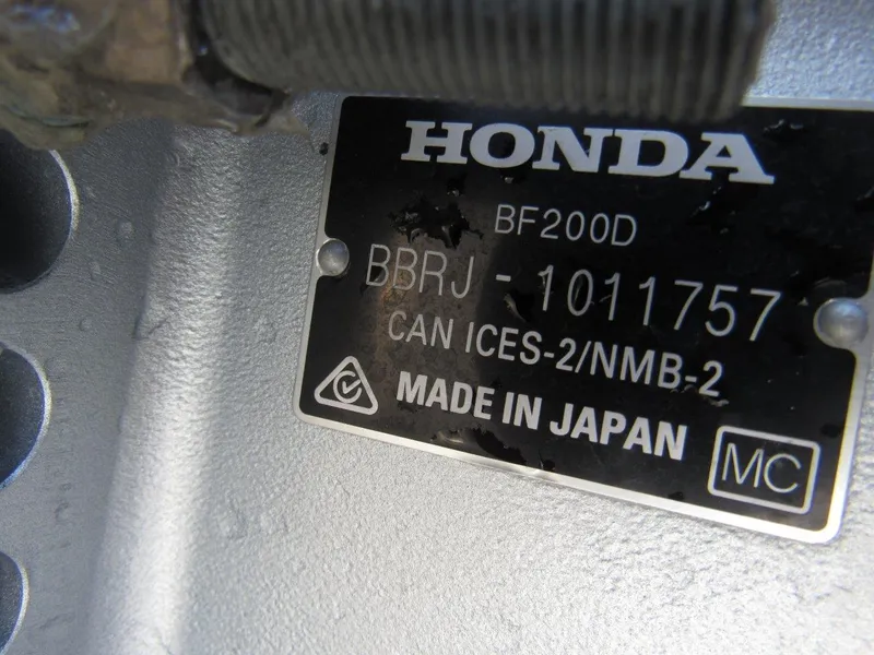 Slide: The Image of Honda BF200D engine plate on 2023 Hewescraft 210 Sea Runner ET, made in Japan. - 19