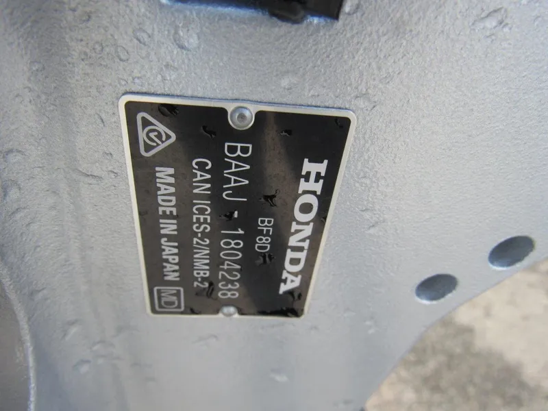 Slide: The Image of Close-up of a Honda engine plate on a 2023 Hewescraft 210 Sea Runner ET. - 20