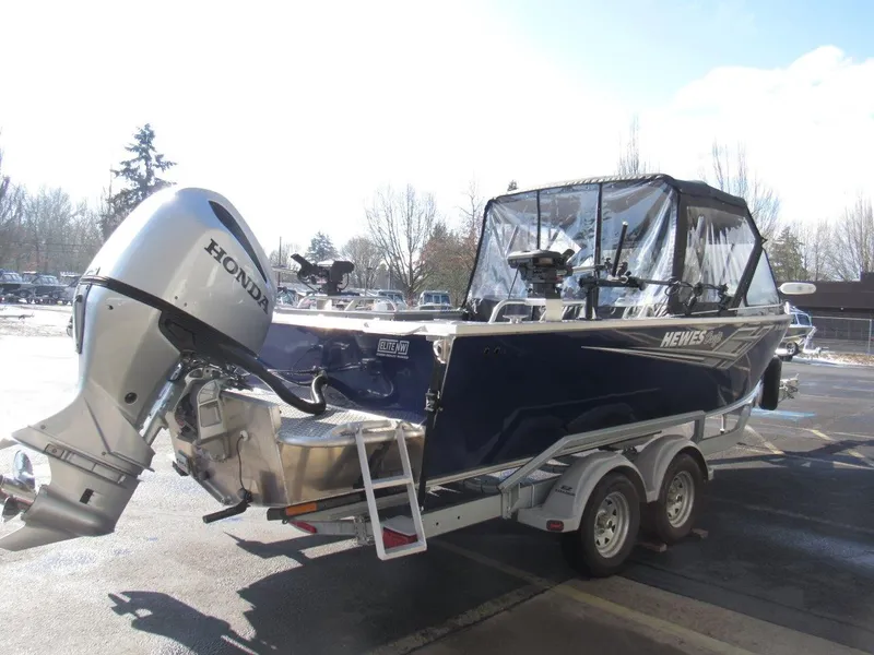 Slide: The Image of 2023 Hewescraft 210 Sea Runner ET boat with Honda outboard motor on trailer. - 5
