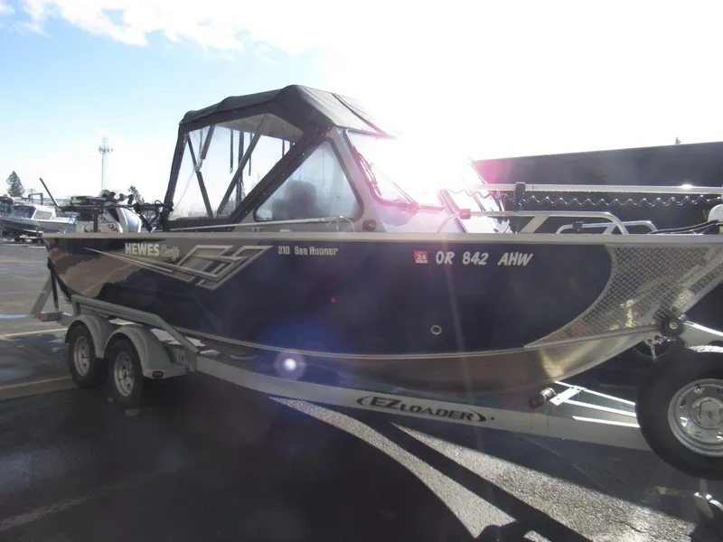 Slide: The Image of 2023 Hewescraft 210 Sea Runner ET boat on trailer, side view. - 7