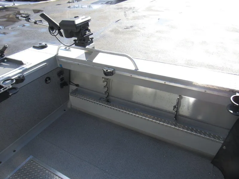 Slide: The Image of 2023 Hewescraft 210 Sea Runner ET interior with fishing rod holder and storage. - 9
