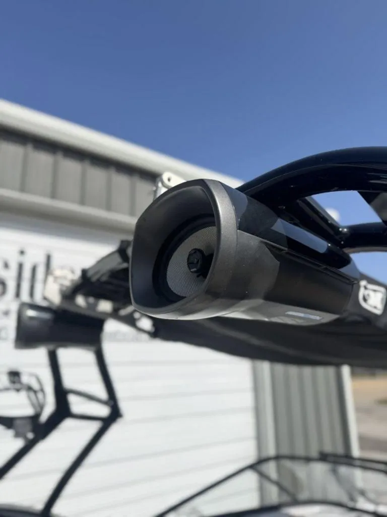 Slide: The Image of Close-up of a 2015 Nautique G21 boat speaker against a clear blue sky. - 13