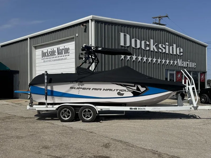 Slide: The Image of 2015 Nautique G21 boat on trailer at Dockside Marine dealership. - 16