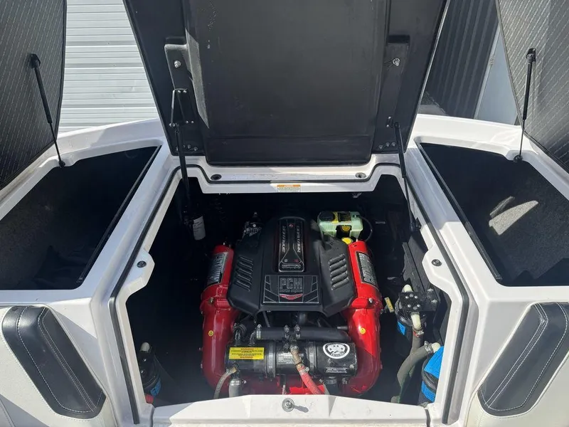 Slide: The Image of 2015 Nautique G21 engine compartment with PCM engine, open hatch view. - 6